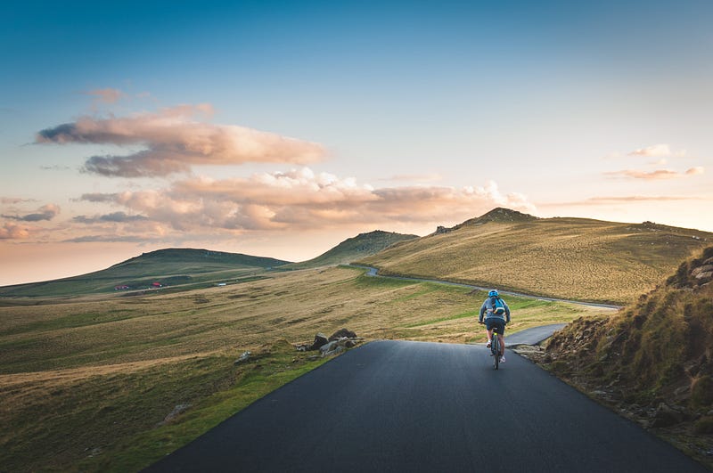 A scenic view of a bike on a winding path.