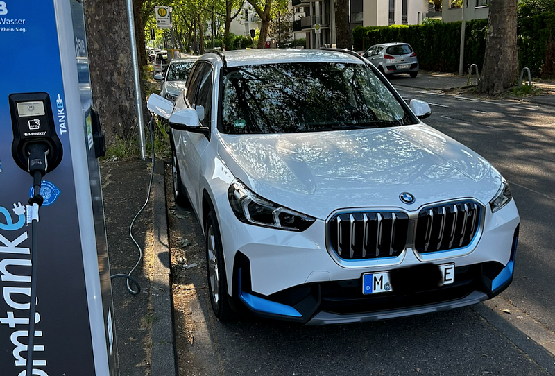 The BMW iX1 charging at a station in Bonn, Germany